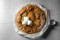 Delicious apple galette served with ice cream on light grey textured table, top view Royalty Free Stock Photo