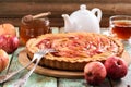 Delicious apple pie with organic red apples, honey and tea on sh Royalty Free Stock Photo