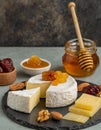 Delicious artisan cheese dish with honey and dried fruits