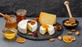 Delicious artisan cheese dish with honey and dried fruits