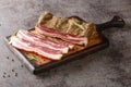 Delicious artisanal whole smoked slab bacon closeup on the wooden board. Horizontal