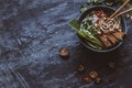 Delicious asian bowl with rice noodles, vegetables and tofu on w