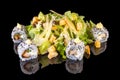 Delicious Asian Caesar salad with sushi with reflection Royalty Free Stock Photo