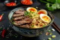 Delicious Asian noodle soup with beef and boiled eggs