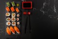 Delicious assorted sushi set with chopsticks and soy sauce on a  stone board Royalty Free Stock Photo