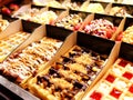 Delicious assorted Waffles on window shop in Bruxelles Belgium