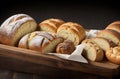 Delicious Assortment of Baked Bread and Rolls on a Rustic Black Bakery Table Counter. Royalty Free Stock Photo