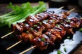 A delicious assortment of meat and vegetables skewered and placed on a sleek black plate, Grilled teriyaki chicken skewers, AI