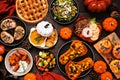 Delicious autumn meal table scene. Top view on a dark wood background. Royalty Free Stock Photo