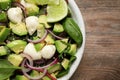 Delicious avocado salad with mozzarella on table, top view Royalty Free Stock Photo