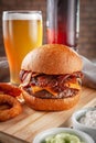 Delicious bacon burger with onion rings Royalty Free Stock Photo