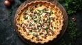 Delicious bacon and cheese quiche in a rustic crust, garnished with fresh herbs Royalty Free Stock Photo