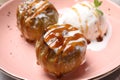 Delicious baked apples with nuts, ice cream and caramel on plate, closeup Royalty Free Stock Photo