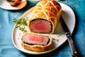 Delicious baked Beef Wellington wrapped in puff pastry. Holiday meal for family dinner