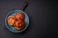 Delicious baked cinnamon raisin rolls in the form of rolls Royalty Free Stock Photo
