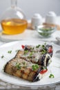 Delicious baked eggplant rolls served on table, closeup Royalty Free Stock Photo