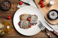 Delicious baked eggplant rolls served on wooden table, flat lay Royalty Free Stock Photo