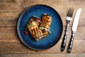 Delicious baked eggplant rolls served on wooden table, flat lay Royalty Free Stock Photo