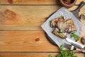 Delicious baked eggplant rolls served on wooden table, flat lay. Space for text Royalty Free Stock Photo