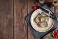 Delicious baked eggplant rolls served on wooden table, flat lay. Space for text Royalty Free Stock Photo