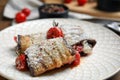 Delicious baked eggplant rolls with tomatoes and cheese on plate, closeup Royalty Free Stock Photo