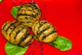 Delicious baked potatoes with bacon, mushrooms on a red plate. Dish for dinner. Close up view Royalty Free Stock Photo