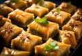 Delicious baklava dessert in oriental setting on black background