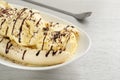 Delicious banana split ice cream with toppings on white wooden table, closeup Royalty Free Stock Photo