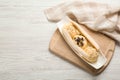 Delicious banana split ice cream with toppings on white wooden table, top view. Space for text Royalty Free Stock Photo