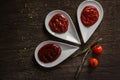 Delicious barbecue sauces in bowls on wooden background