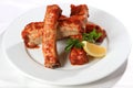 Delicious barbecued pork ribs on white plate Royalty Free Stock Photo