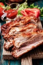 Delicious barbecued ribs seasoned with a spicy basting sauce Royalty Free Stock Photo