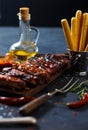 Delicious barbecued ribs seasoned with a spicy basting sauce and served with chopped Royalty Free Stock Photo