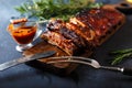 Delicious barbecued ribs seasoned with a spicy basting sauce and served with chopped Royalty Free Stock Photo