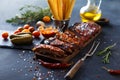 Delicious barbecued ribs seasoned with a spicy basting sauce and served with chopped Royalty Free Stock Photo