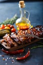 Delicious barbecued ribs seasoned with a spicy basting sauce and served with chopped Royalty Free Stock Photo