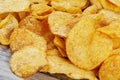 Delicious Barbeque Flavored Potato Chips isolated on a wooden background