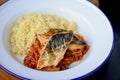 Delicious battered fish on a plate with garnish. Tasty healthy food served in a white plate Royalty Free Stock Photo