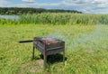 delicious bbq kebab grilling on open grill, outdoor kitchen. tasty food roasting on skewers, food-court. summer picnic Royalty Free Stock Photo