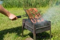 Delicious bbq kebab grilling on open grill, outdoor kitchen. tasty food roasting on skewers, food-court. summer picnic Royalty Free Stock Photo