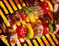 Delicious bbq kebab skewers on fire Royalty Free Stock Photo