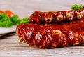 Delicious BBQ pork ribs with herbs and tangy BBQ sauce Royalty Free Stock Photo