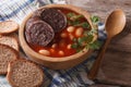 Delicious bean soup Fabada asturiana closeup horizontal