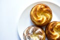 Delicious and beautiful curd rolls on a white plate with sprinkles