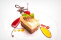 A delicious and beautiful slice of white and dark chocolate torte with fresh fruit coulis.