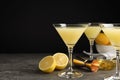 Delicious bee`s knees cocktails and ingredients on grey table against background, space for text Royalty Free Stock Photo