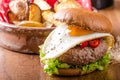 Delicious beef burger with egg Royalty Free Stock Photo