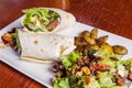 Delicious beef kabab with fresh salad and grilled garlic