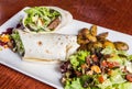 Delicious beef kabab with fresh salad and grilled garlic