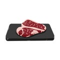 Delicious beef steak on stone tray. Rib eye. Sirloin. Uncooked raw meat